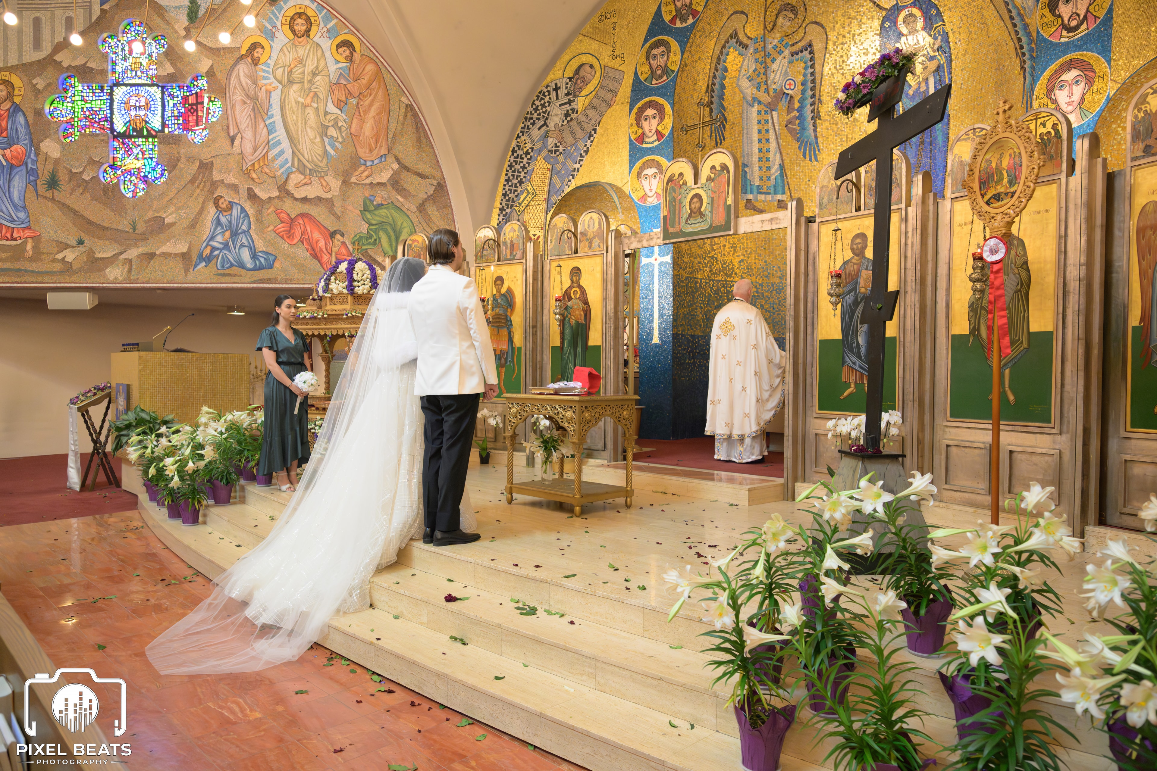 Bride and groom at the altar of an orthodox church ceremony