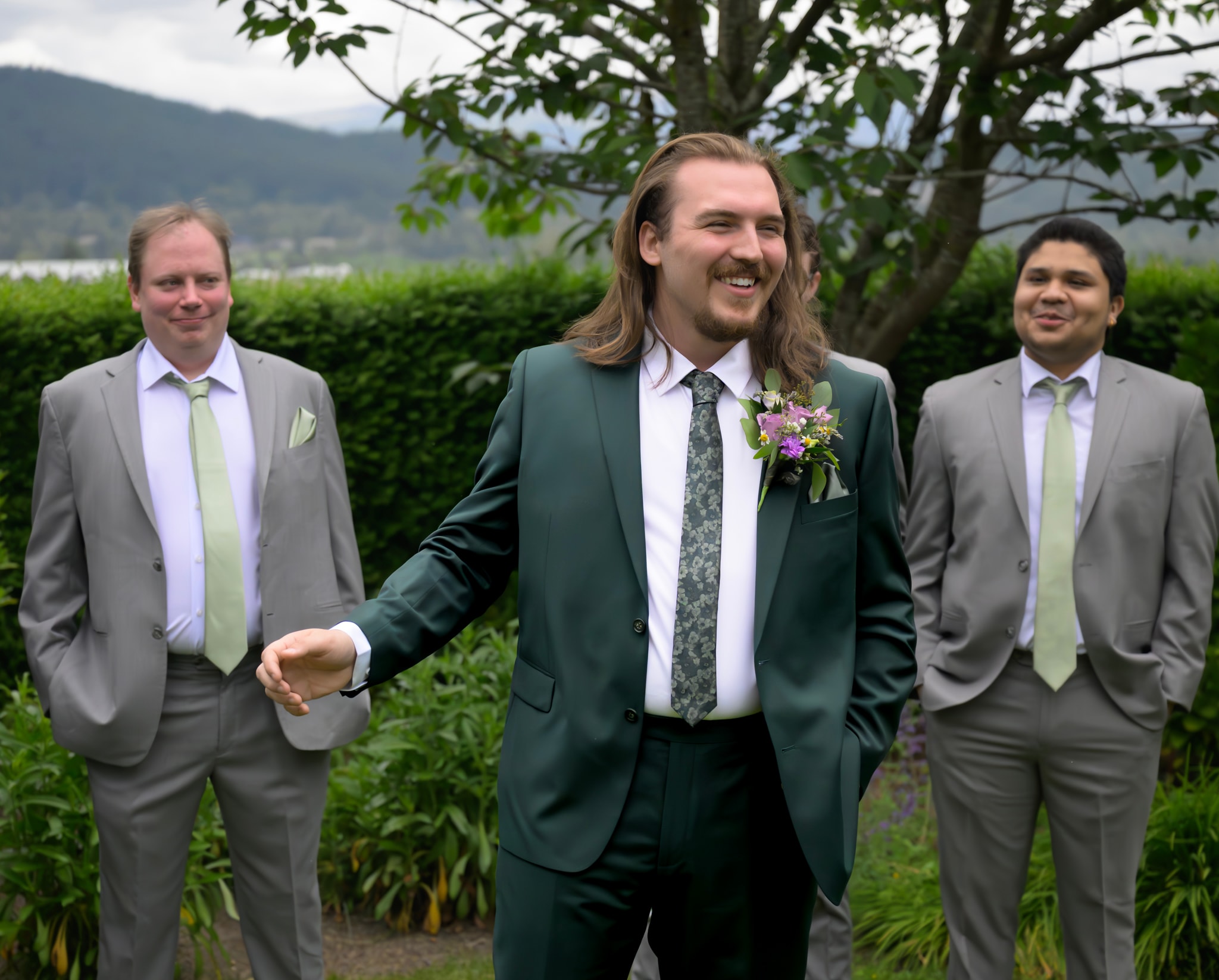 Groom and groomsmen posing outdoors