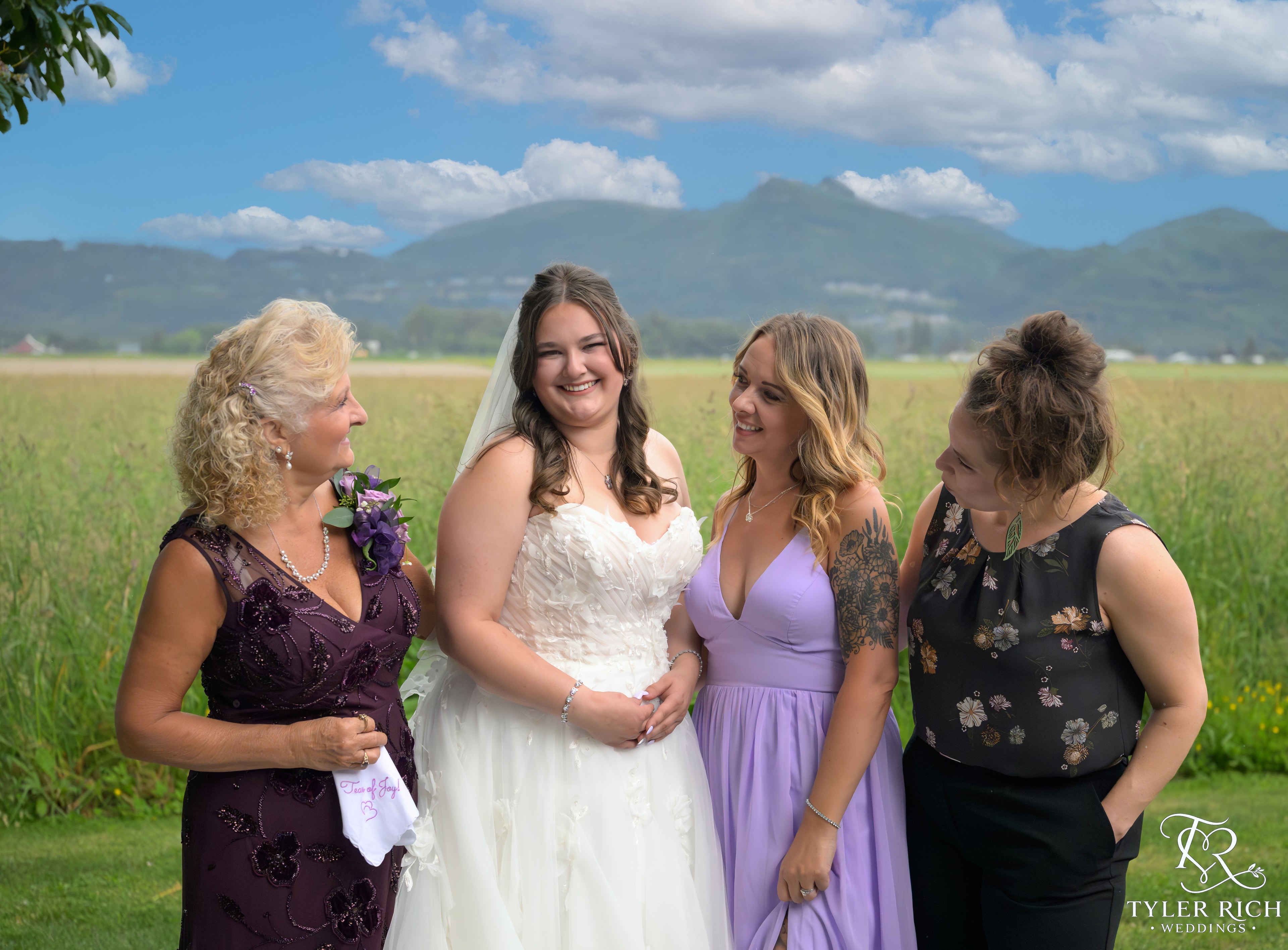 Bride with family in a mountain field